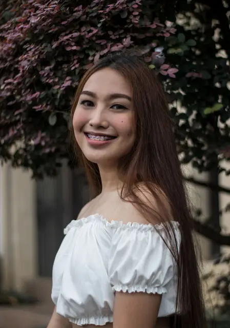 A young Filipina smiling with braces