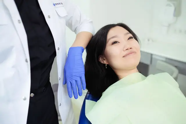A patient smiling during a dental check-up